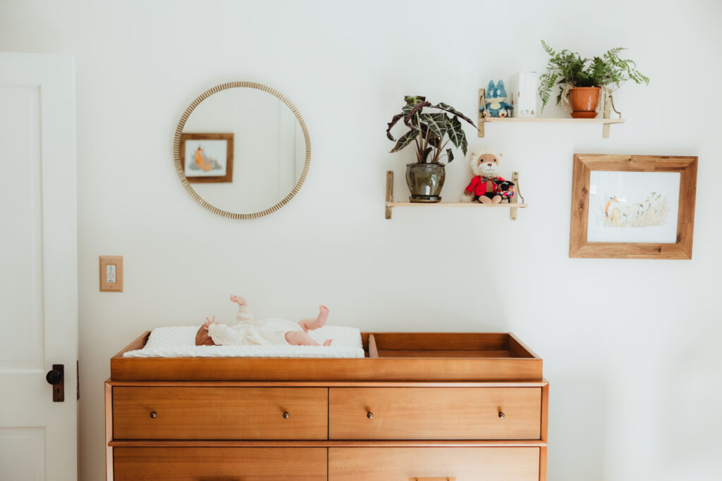 Newborn baby peacefully sleeping in a cozy nursery, captured by a Sun Prairie Newborn Photographer Elizabeth Pachniak Photography.